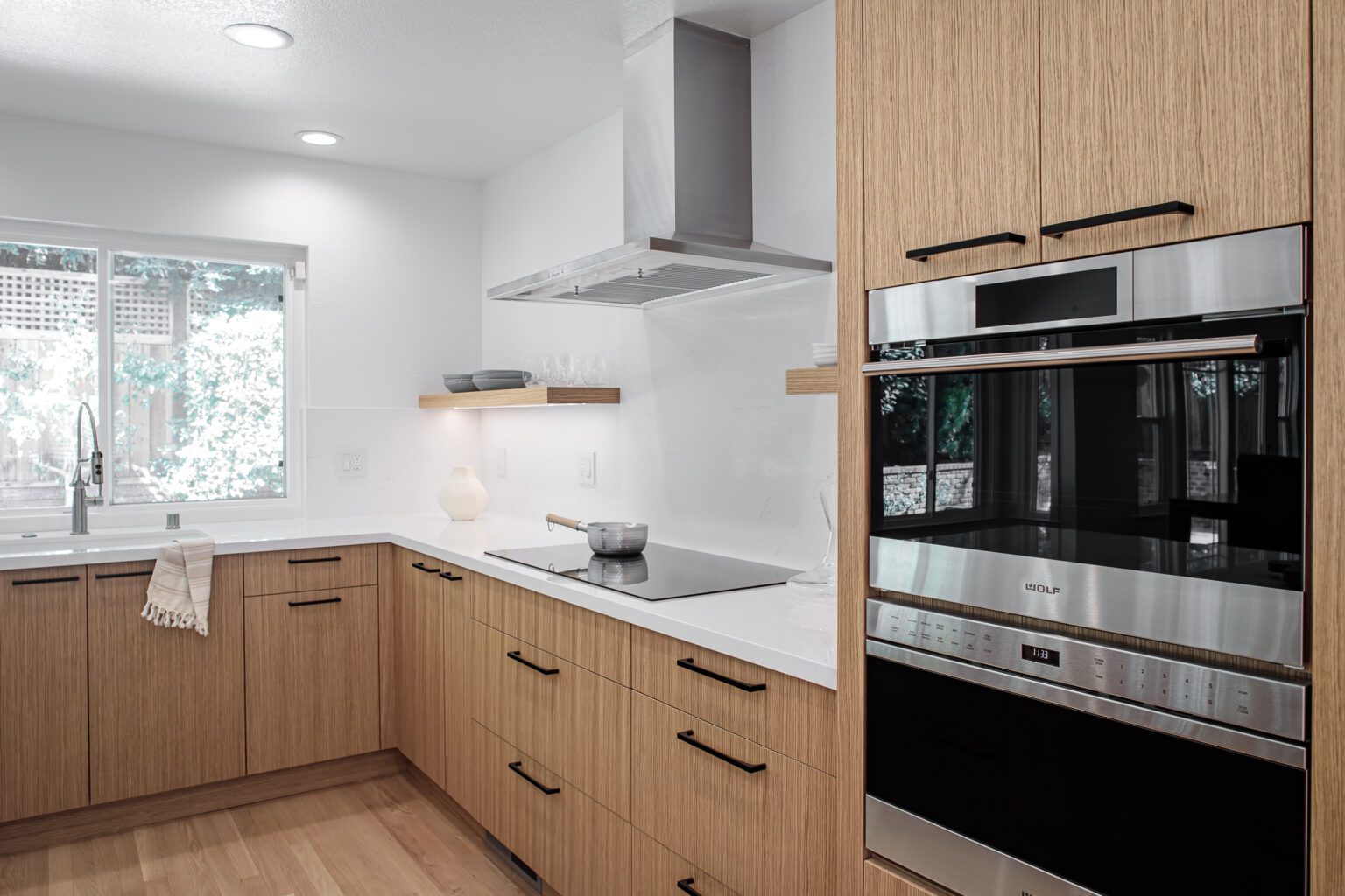 Kitchen Remodeling Cost Guide for King County inspiration. Slab front kitchen cabinets with quartz countertops