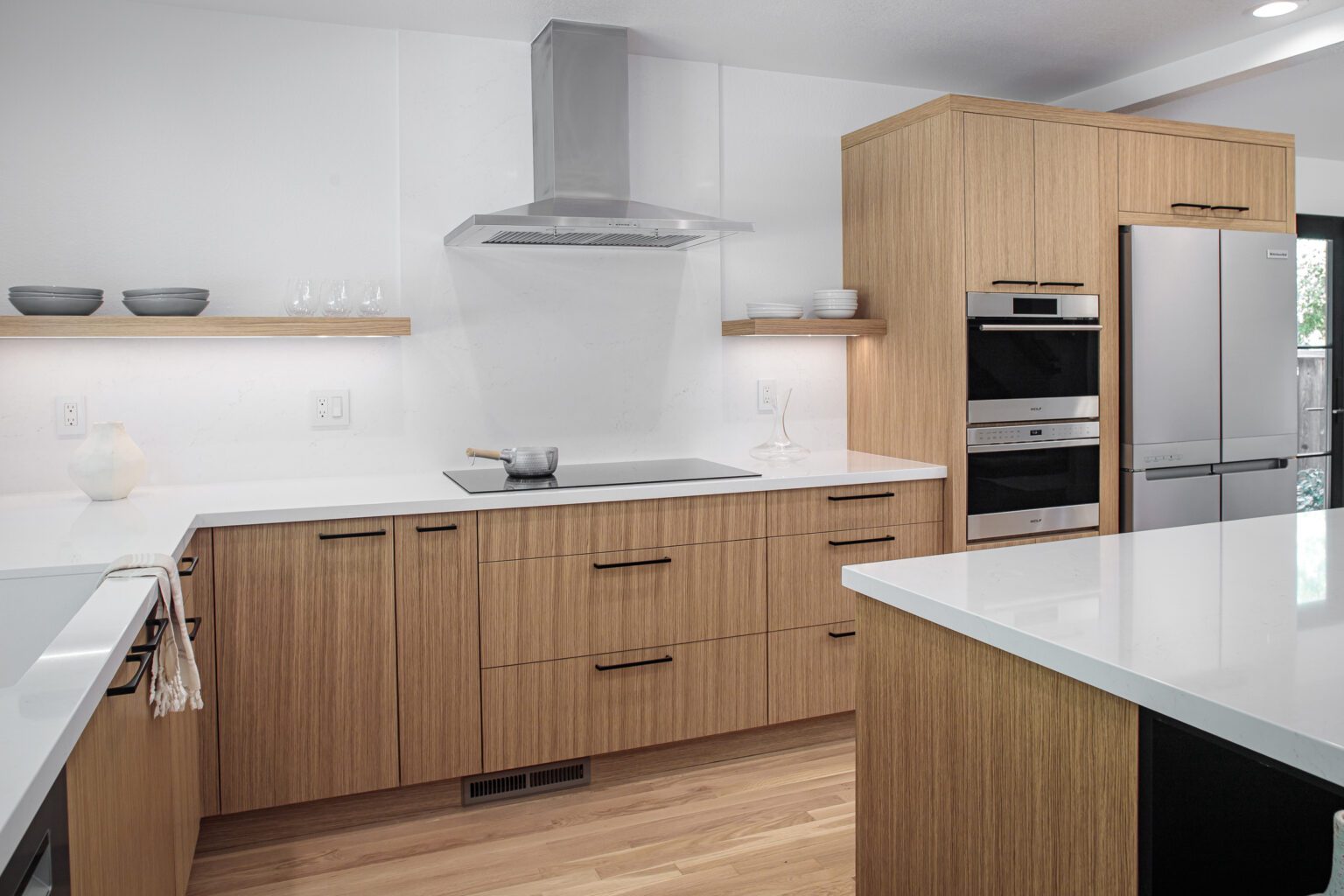 Quartz vs Granite Countertops inspiration. Vertical grain oak kitchen cabinets in a premium remodel